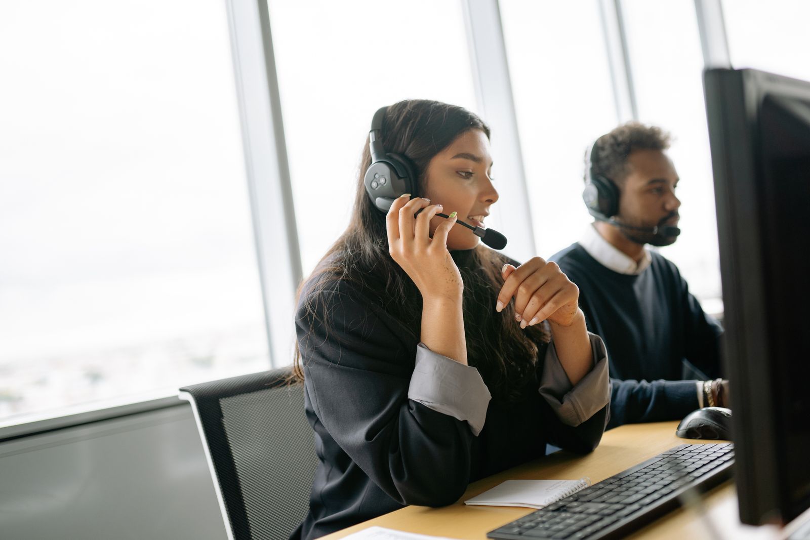 Customer service team working together in a modern call center